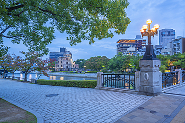 View of the skeletal ruins of the A-Bomb Dome from Motoyasu Bridge at dusk, UNESCO, Hiroshima, Honshu, Japan