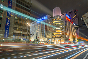 View of street scene, trail lights and shopping mall in Hiroshima at night, Hiroshima, Honshu, Japan