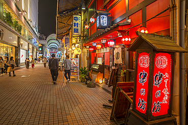 View of colourful entrance of a restaurant in shopping arcade at night, Hiroshima, Honshu, Japan, Asia