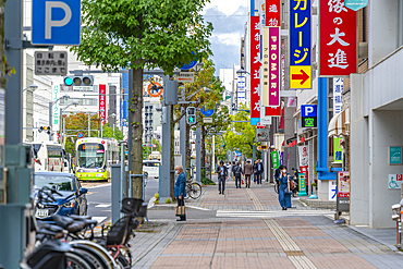 View of city tram on major street during daytime, Hondori, Naka Ward, Hiroshima, Honshu, Japan