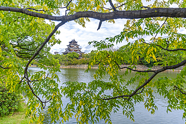 View of Hiroshima Castle, with museum, reflecting in Moat, Motomachi, Naka Ward, Hiroshima, Honshu, Japan