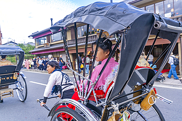 View of rickshaws near Togetsukyo Bridge over Katsura River, Sagatenryuji Susukinobabacho, Ukyo Ward, Kyoto, Honshu, Japan