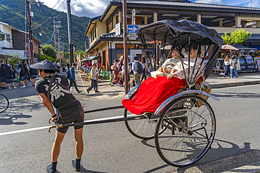 View of rickshaws near Togetsukyo Bridge over Katsura River, Sagatenryuji Susukinobabacho, Ukyo Ward, Kyoto, Honshu, Japan