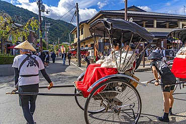 View of rickshaws near Togetsukyo Bridge over Katsura River, Sagatenryuji Susukinobabacho, Ukyo Ward, Kyoto, Honshu, Japan