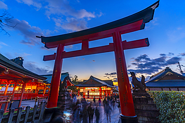 View of Torii Gate at Kyoto's Fushimi Inari Buddist Temple at dusk, Fukakusa Yabunouchicho, Fushimi Ward, Kyoto, Japan, Asia