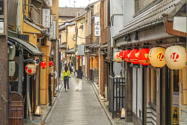 View of narrow street with Japanese lanterns in Nakagyo Ward, Nabeyacho, Kyoto, Honshu, Japan