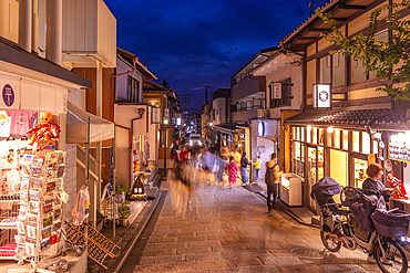 View of shops and narrow street in Sannen Zaka in Gion at dusk, Kyoto Geisha District, Kyoto, Honshu, Japan