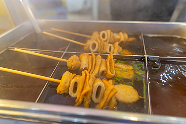 View of hot food stall in Dotonbori, vibrant entertainment district near the river, Osaka, Honshu, Japan, Asia