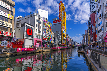 View of restaurants and Ebisu Tower Ferris Wheel in Dotonbori, vibrant entertainment district near the river, Osaka, Honshu, Japan, Asia