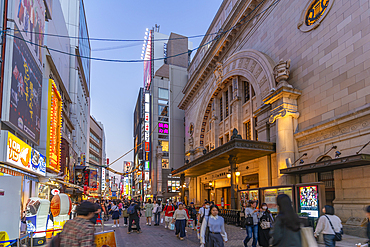 View of colourful facades of restaurants in Dotonbori at dusk, vibrant entertainment district near the river, Osaka, Honshu, Japan