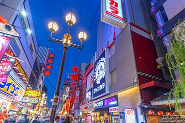 View of colourful facades of restaurants in Dotonbori, vibrant entertainment district near the river, Osaka, Honshu, Japan