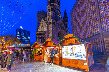 View of Kaiser Wilhelm Memorial Church and market stalls at Christmas, Breitscheidplatz, Berlin, Germany, Europe