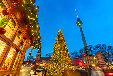 View of Berlin TV Tower and Christmas tree in Wasserkaskaden at dusk, Mitte, Berlin, Germany, Europe