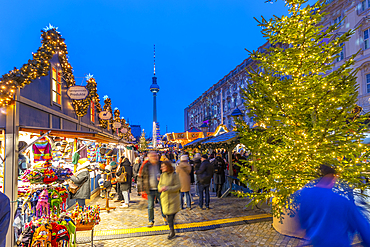 View of Christmas market stalls in Vorplatz Berliner Schloss at Christmas and Berlin TV Tower in background, Mitte, Berlin, Germany, Europe