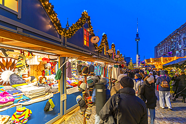 View of Christmas market stalls in Vorplatz Berliner Schloss at Christmas and Berlin TV Tower in background, Mitte, Berlin, Germany, Europe