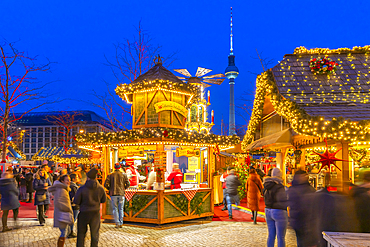 View of Christmas market stalls in Vorplatz Berliner Schloss at Christmas and Berlin TV Tower in background, Mitte, Berlin, Germany, Europe