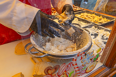 View of food making on Christmas Market stall in Altstadt Spandau, Spandau, Berlin, Germany, Europe