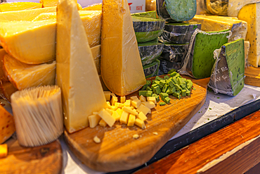 View of local cheeses on Christmas market stall, Stortingsparken, Oslo, Norway, Scandinavia, Europe