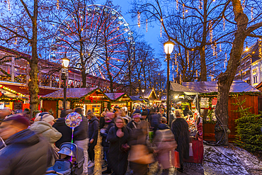 View of Christmas market and ferris wheel during winter at dusk, Stortingsparken, Oslo, Norway, Scandinavia, Europe