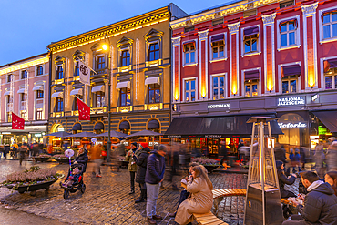 View of cafes, bars and architecture on Karl Johans Gate during winter at dusk, Oslo, Norway, Scandinavia