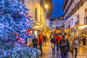 View of Christmas tree and decorations on via Roma at dusk, Courmayeur, Aosta Valley, Italy, Europe