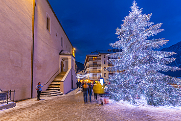 View of Christmas tree and decorations in Piazza Abbé Henry at dusk, Courmayeur, Aosta Valley, Italy, Europe