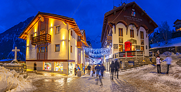 View of Christmas lights and decorations in Piazza Abbé Henry at dusk, Courmayeur, Aosta Valley, Italy, Europe