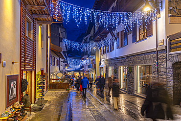 View of Christmas lights and decorations on via Roma at dusk, Courmayeur, Aosta Valley, Italy, Europe