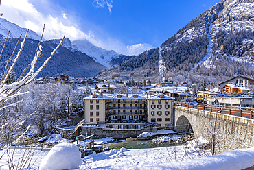 View of snow covered trees, mountains and Dolonne from Courmayeur during winter, Courmayeur, Aosta Valley, Italy, Europe