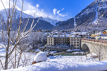 View of snow covered trees, mountains and Dolonne from Courmayeur during winter, Courmayeur, Aosta Valley, Italy, Europe