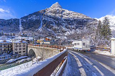 View of snow covered trees, mountains and Dolonne from Courmayeur during winter, Courmayeur, Aosta Valley, Italy, Europe