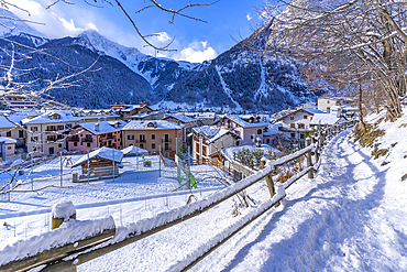 View of snow covered mountains and rooftops in Courmayeur during winter, Courmayeur, Aosta Valley, Italy, Europe