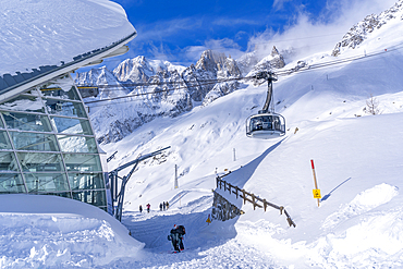 View of snow covered Pavillon du Mont Fréty and Skyway Monte Bianco cable car in winter, Courmayeur, Aosta Valley, Italy, Europe