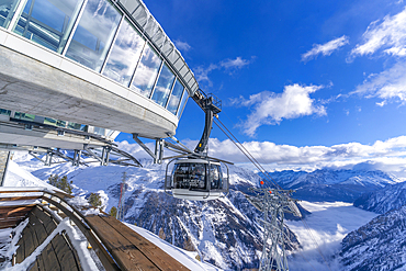 View of snow covered Aosta Valley, mountains and Skyway Monte Bianco cable car in winter, Courmayeur, Aosta Valley, Italy, Europe