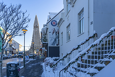 View of Hallgrimskirkja Church and suburb street in the city centre of Reykjavík during winter, Reykjavík, Iceland, Europe