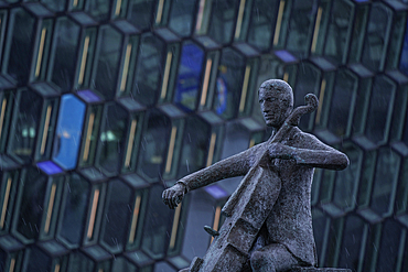 View of Sellóspilarinn statue and the Harpa Concert Hall and Conference Centre, Reykjavík, Iceland, Europe