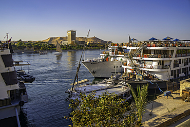 View of cruiseboats on the Nile river from the promenade on a sunny day, Aswan, Nubia, Egypt, North Africa, Africa