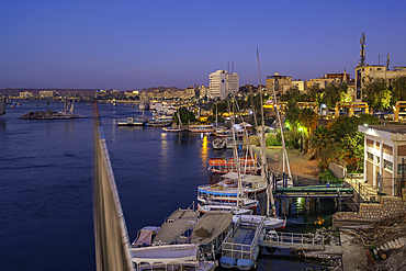 View of fellucas on the Nile river from Feryal Garden at dusk, Aswan, Nubia, Egypt, North Africa, Africa