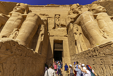 Exterior view of tourists and relief mural of Ebsambul or Isambul at the Abu Simbel Temple next to Lake Nasser, Temple of the Pharaohs, Ramses II, Nubia, Egypt, Africa