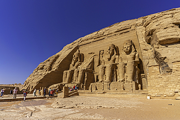 Exterior view of tourists and massive sculptures at the Abu Simbel Temple next to Lake Nasser, Temple of the Pharaohs, Ramses II, Nubia, Egypt, Africa