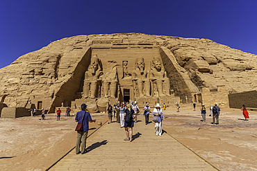 Exterior view of tourists and massive sculptures at the Abu Simbel Temple next to Lake Nasser, Temple of the Pharaohs, Ramses II, Nubia, Egypt, Africa