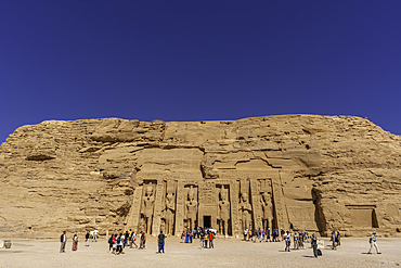 Exterior view of tourists and massive sculptures at the Temple of Hathor, Abu Simbel Temple next to Lake Nasser, Temple of the Pharaohs, Ramses II, Nubia, Egypt, Africa