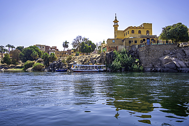 View of architecture on the Nile river from small boat in Aswan, Aswan, Nubia, Egypt, North Africa, Africa
