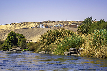 View of architecture on the Nile river from small boat in Aswan, Aswan, Nubia, Egypt, North Africa, Africa