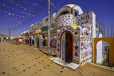 View of colourful architecture at Nagaa Suhayl Gharb on the Nile river near Aswan, Aswan, Nubia, Egypt, North Africa, Africa