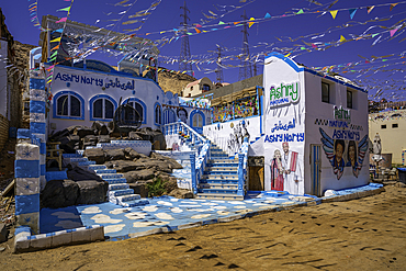 View of colourful architecture at Nagaa Suhayl Gharb on the Nile river near Aswan, Aswan, Nubia, Egypt, North Africa, Africa