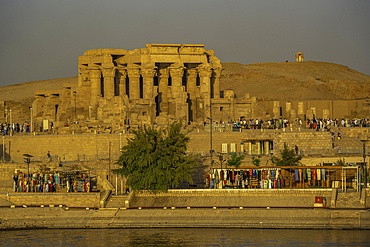 View of Kom Ombo Temple on the Nile river from cruise boat at sunset, Aswan, Nubia, Egypt, North Africa, Africa