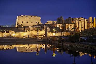 View of Karnak Temple sound and light show at dusk, Luxor, Egypt, Africa