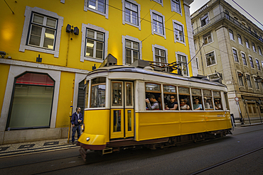 View of vintage yellow No28 tram in hystoric old town centre, Lisbon, Portugal, Europe