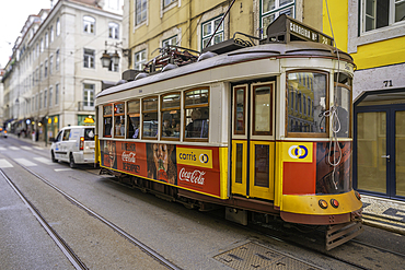 View of vintage No28 yellow tram in Lisbon city centre, Lisbon, Portugal, Europe
